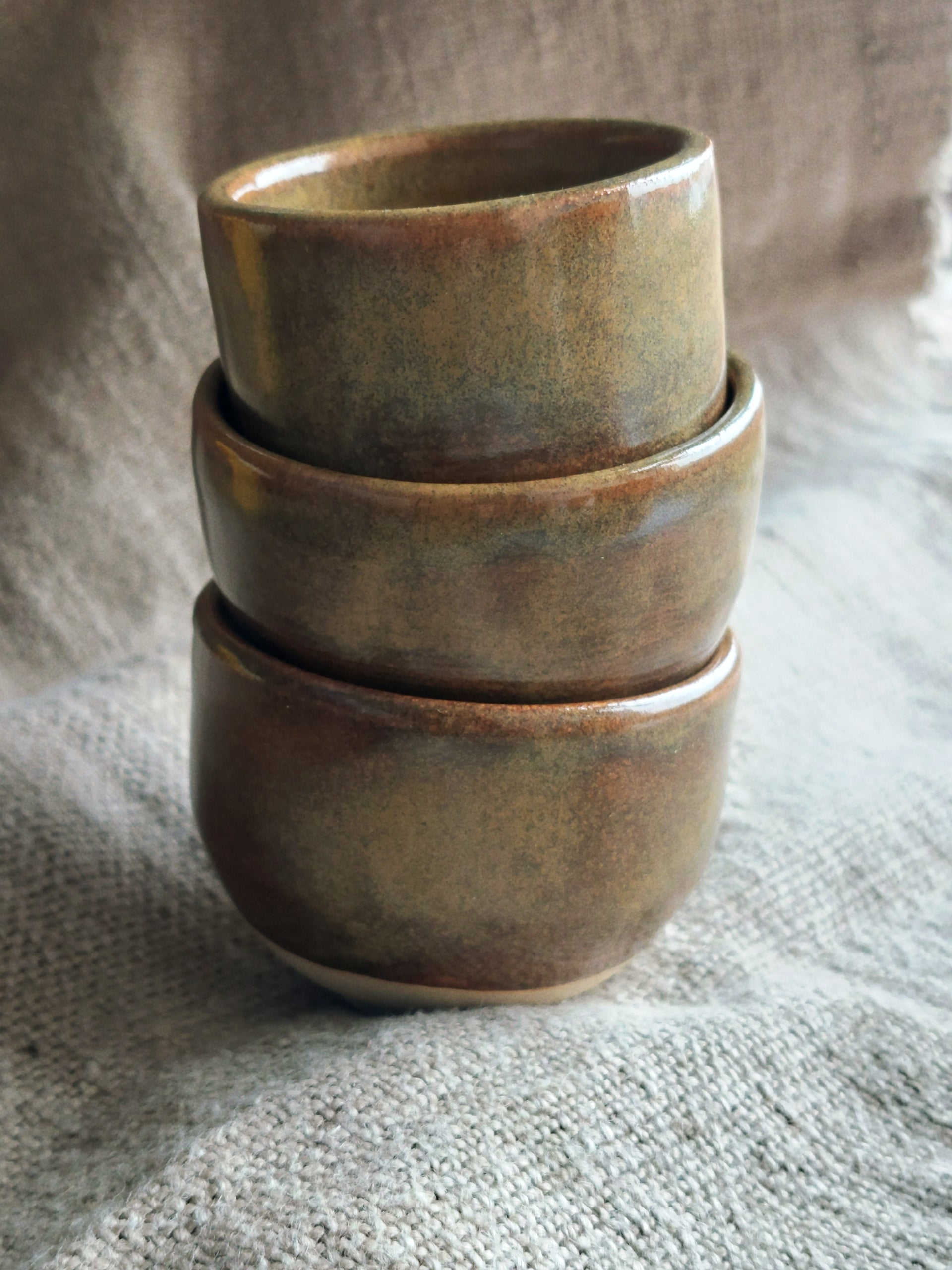 A stack of handmade ceramic cups